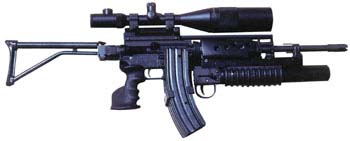 Olympic Arms folder with grenade launcher/24x56mm scope/3-40 rd mag attachment.